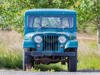 REYKJAVIK, ICELAND - July 29, 2016: Selective focus on an abandoned Willys Jeep on Iceland. Willys Jeeps were made by Willys-Overland Motors from 1947 to 1965.