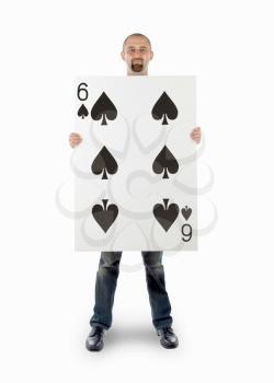 Businessman with large playing card - Six of spades