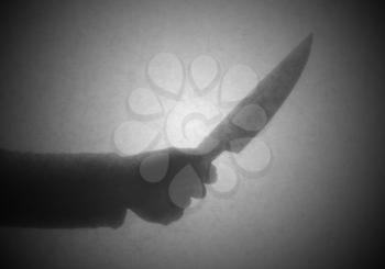 Silhouette behind a transparent paper - Knife threat