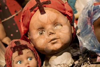 Scary white doll face, very old and broken