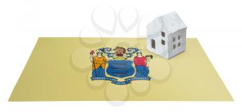Small house on a flag - Living or migrating to New Jersey
