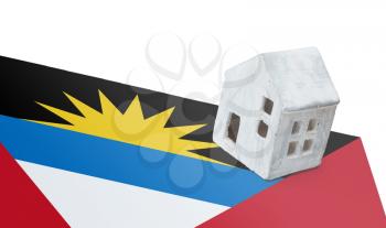 Small house on a flag - Living or migrating to Antigua and Barbuda