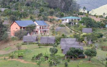 Typical Malagasy landscape, houses in the jungle
