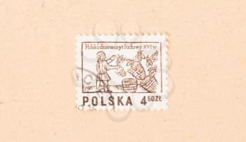 POLAND - CIRCA 1970: A stamp printed in Poland shows a beekeeper with his hives, circa 1970