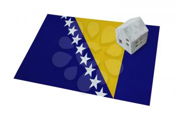 Small house on a flag - Living or migrating to Bosnia Herzegovina