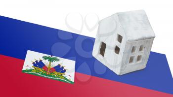 Small house on a flag - Living or migrating to Haiti