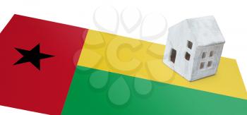 Small house on a flag - Living or migrating to Guinea Bissau