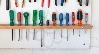 Assorted tools on a white tool board - Simple setting