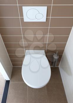 Modern white toilet bowl in the bathroom