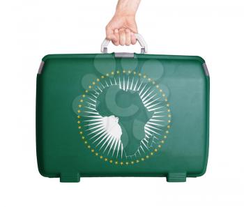 Used plastic suitcase with stains and scratches, printed with flag - African Union