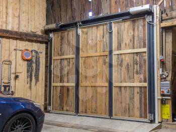 Garage with closed door - Car inside, Austrian Alps