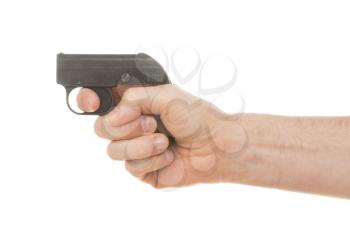 Small old alarm pistol in the hands of an adult man