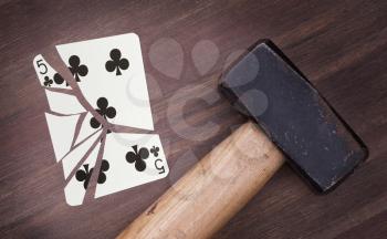 Hammer with a broken card, vintage look, five of clubs
