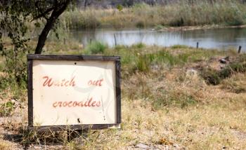 Sign boar indicated to the guests the presence of crocodiles - Botswana