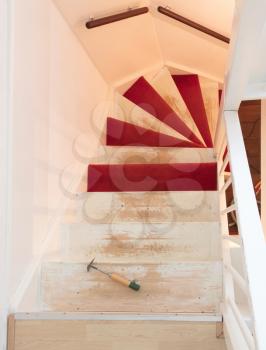 Removing carpet, glue and paint from an vintage stairs - Selective focus