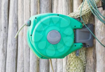 Garden hose hanging on a wall - The Netherlands