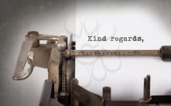 Close-up of an old typewriter with paper, selective focus, Kind regards