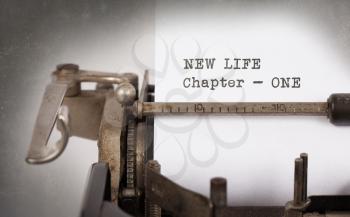 Vintage inscription made by old typewriter, new life, chapter 1