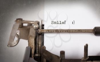 Close-up of a vintage typewriter, old and rusty, smile