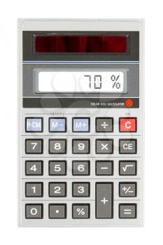 Old calculator with digital display showing a percentage - 70 percent