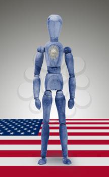Old wood figure mannequin with US state flag bodypaint - New Hampshire