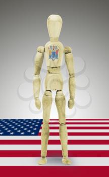 Old wood figure mannequin with US state flag bodypaint - New Jersey