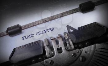 Vintage inscription made by old typewriter, First chapter