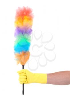 Man with yellow cleaning glove holding a duster - isolated