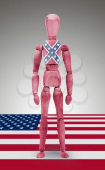 Jointed wooden mannequin isolated on white background, USA, Confederate flag