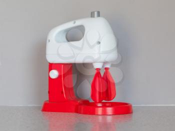 Toy cooking mixer or blender, isolated in the kitchen