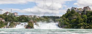 RHEINFALLS, SWITZERLAND - JULY 25, 2015: View to the biggest waterfalls of Europe in Schaffhausen, Switzerland on May 17, 2015. They are 150 m (450 ft) wide and 23 m (75 ft) high.
