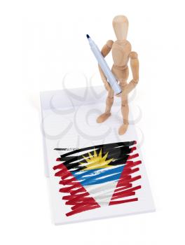 Wooden mannequin made a drawing of a flag - Antigua and Barbuda