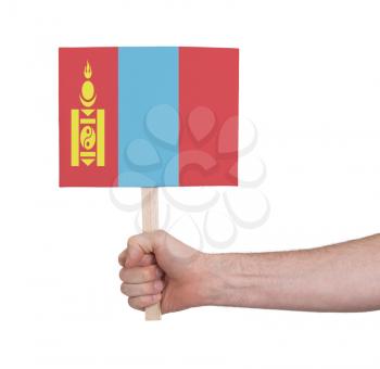 Hand holding small card, isolated on white - Flag of Mongolia