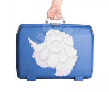 Used plastic suitcase with stains and scratches, printed with flag - Antarctica