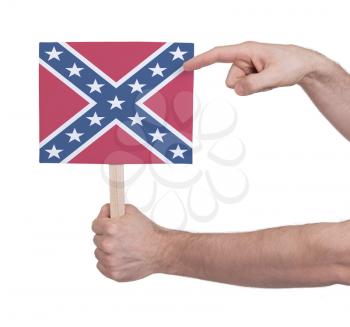 Hand holding small card, isolated on white - Flag of the Confederacy