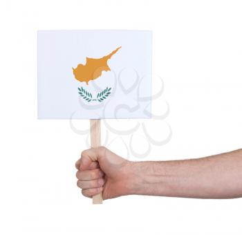 Hand holding small card, isolated on white - Flag of Cyprus