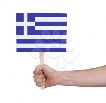 Hand holding small card, isolated on white - Flag of Greece