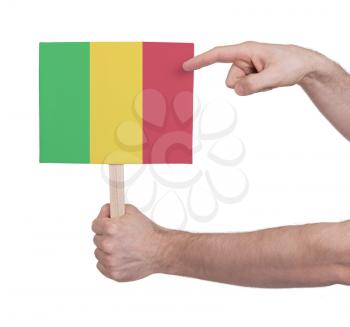 Hand holding small card, isolated on white - Flag of Mali
