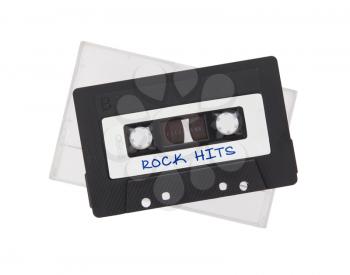 Vintage audio cassette tape, isolated on white background, rock hits
