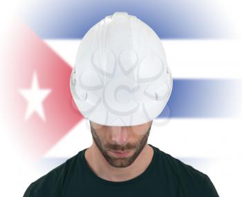 Isolated engineer with flag on background - Cuba