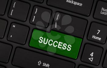 Concept of success - Green laptop keyboard key woth success written on it