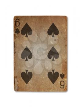 Very old playing card isolated on a white background, six of spades