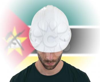 Isolated engineer with flag on background - Mozambique