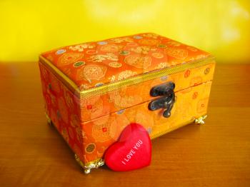Beautiful gold casket in a gift for a holiday to the Valentine's day