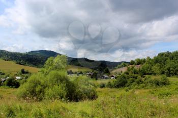 nice landscape with big clouds above Carpathian mountains