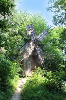 big old mill standing in the forest