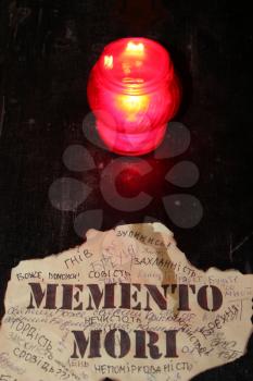candle and inscription memento mori in church