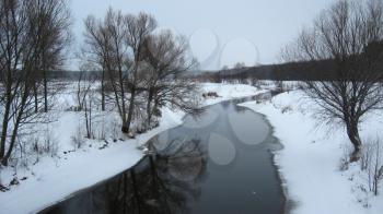 beautiful landscape with winter Ubed river and forest