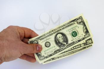 The image of hand holding US dollars isolated on a white background