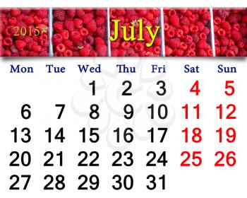 calendar for July of 2015 year on the background of ripe redraspberry